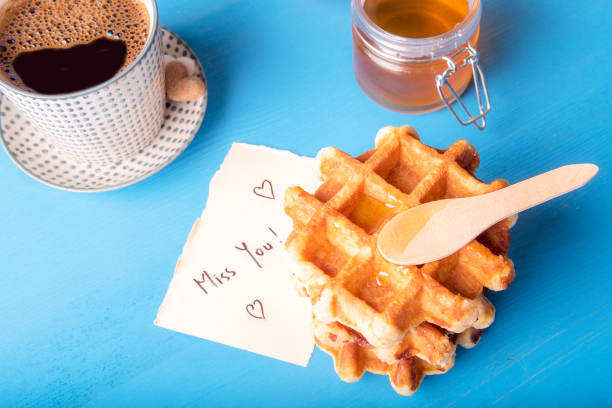 istock Waffles with honey and miss you message 869829036