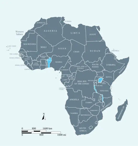 Vector illustration of Africa map vector outline illustration with miles and kilometers scales and countries names labeled in blue background