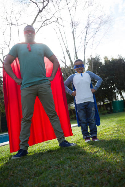 istock Son and father pretending to be a superhero 869830116