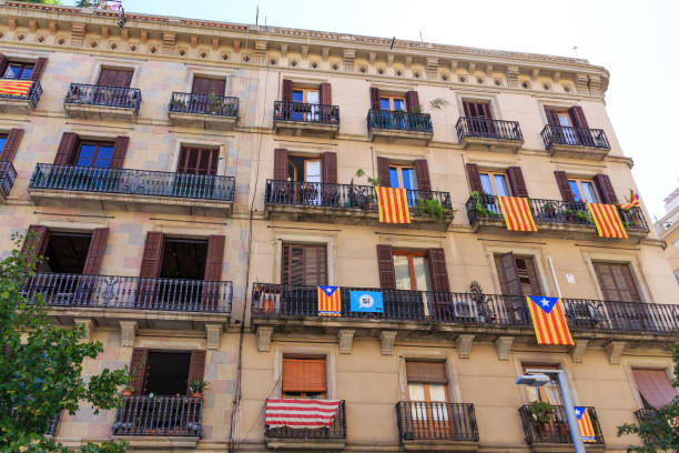 istock Many Flags and Banners on Barcelona Apartment 869831762