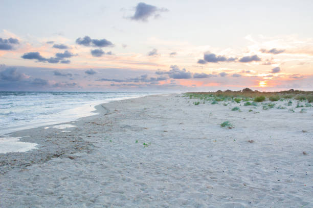 istock Sandy empty sea coast sea view, cloudy colourful sunrise skyview 869834126