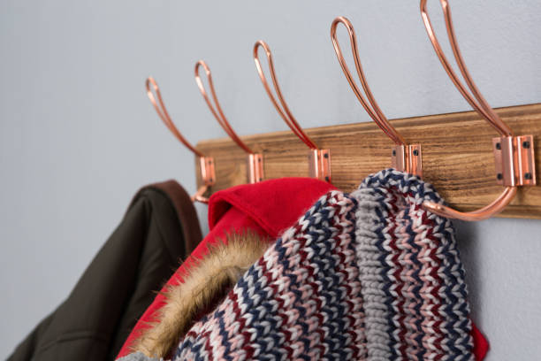 istock Warm clothing hanging on hook 869838346