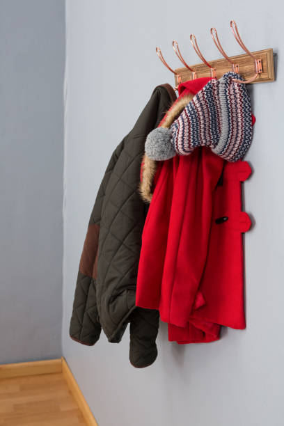 istock Warm clothing hanging on hook 869838354