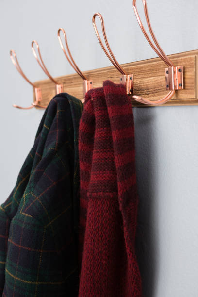 istock Warm clothing hanging on hook 869838554