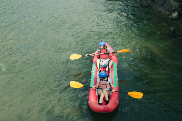 istock People having adventure on river, rafting. Boats top view. 869838674