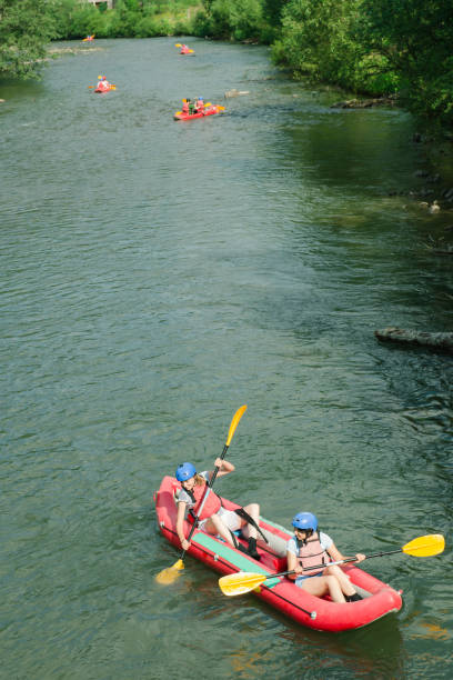 istock People having adventure on river, rafting. Boats top view. 869838764