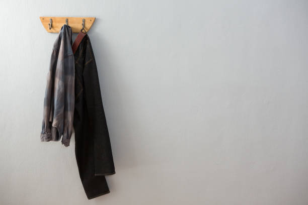 istock Jeans and shirt hanging on hook 869841018