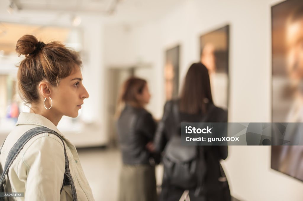 Group of woman looking at modern painting in art gallery Group of woman looking at modern painting in art gallery. Abstract painting Art Museum Stock Photo