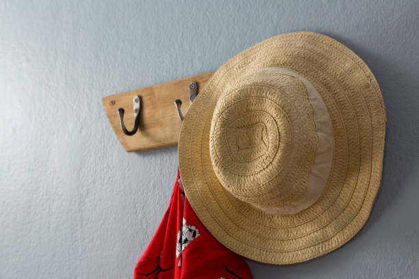 istock Dress and hat hanging on hook 869841298