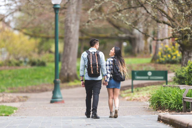 istock Cute young Asian couple on date 869844560