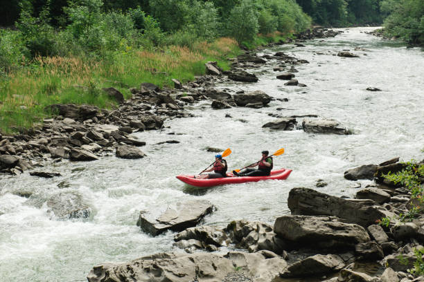 istock Rafting in small boats on river 869845144