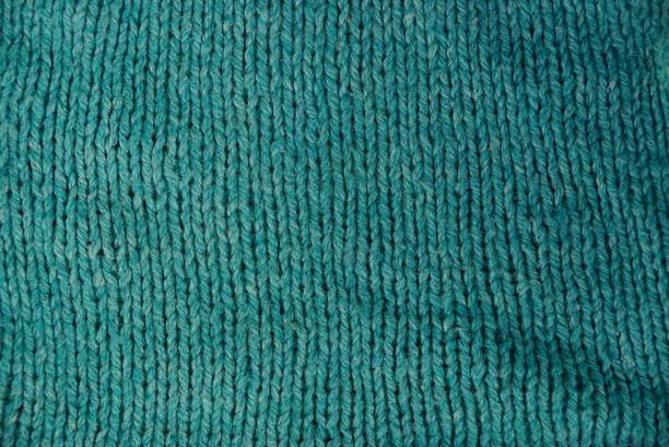 istock Green and crumpled fabric texture from an old skirt 869845554