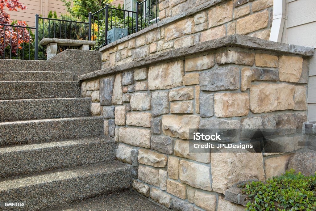 Cultured stone work on front of house in suburban residential neighborhood Stone Material Stock Photo