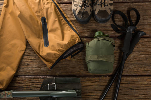 istock Various hiking equipments on wooden plank 869848630