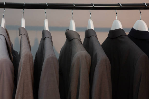 istock Blazers hanging on cloth hanger 869852360