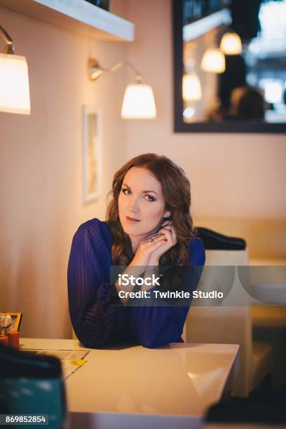 Diwa Angel Mystic Lady Woman Wearing Casual Blue Dress Lonely Sitting In Restaurant Caffe With Coffe Cup Awaiting Her Boyfreind Husband In Beautiful Dreams With Happy Endtender Scene Of Love Story Stock Photo - Download Image Now