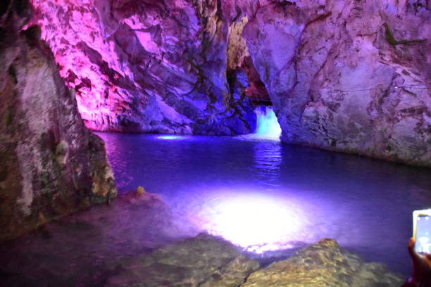 Rays of sunlight in the humid air in the Vranjaca Cave in the hinterland of Split in Croatia.