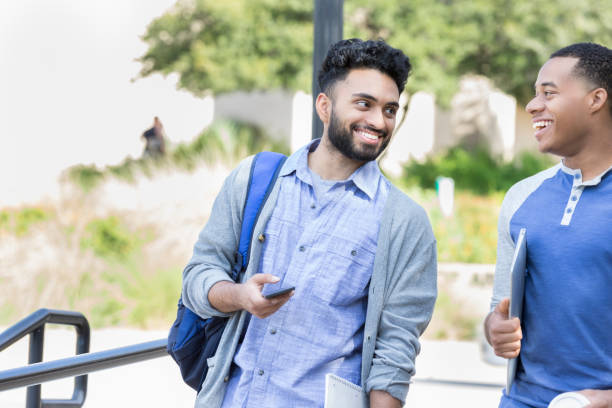 istock Two college buddies walk to class together on campus 869862492