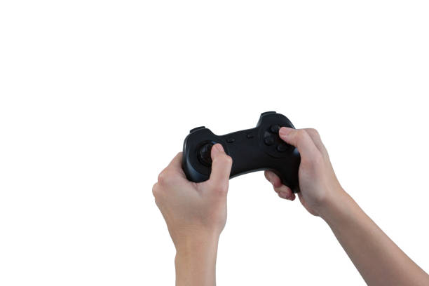 istock Woman playing video game against white background 869866416