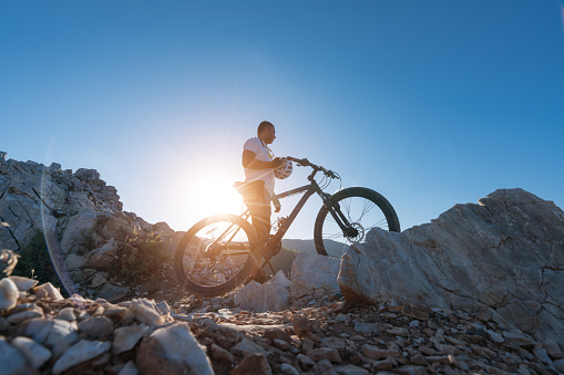 Mountain Biker preparation on a rocky hillside
