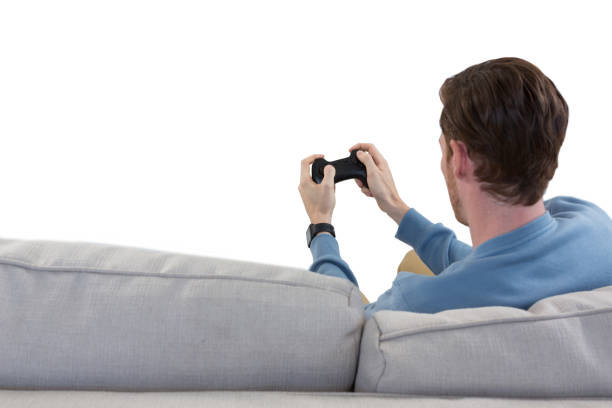 Man playing video game against white background