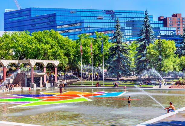 Children Playing Olympic Plaza Fountains Summer Downtown Calgary Alberta Canada.  Olympic Plaza was created in 1988 for Olympic Winter Games.