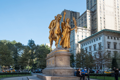 Baltimore, USA - February 18, 2024. Monument to George Armistead with a lady walking dogs on left at Federal Hill Park, Baltimore, Maryland, USA