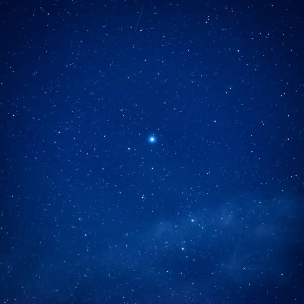 istock Blue dark night sky with many stars 869896104