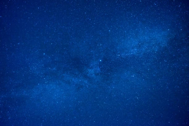 istock Blue dark night sky with many stars 869896212