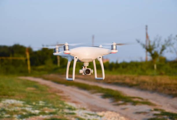 Russia, Poltavskaya village - 28 August 2016. Quadrocopter on roads and background trees. Flying drones.