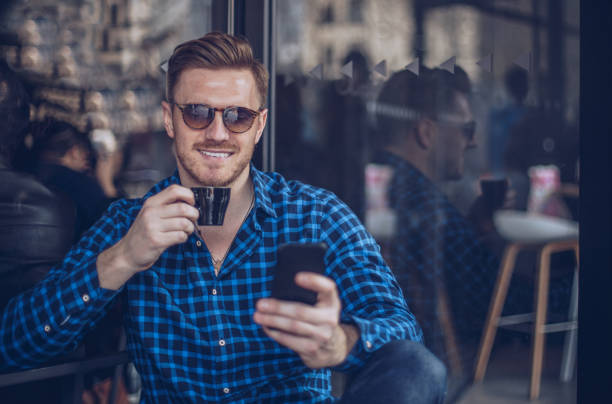 istock Gentleman sitting in cafe 869911444