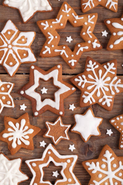 istock Gingerbread Christmas cookies full frame on wooden table. 869912492