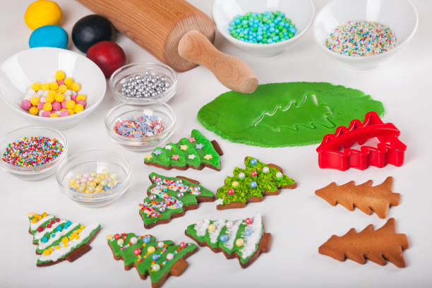 istock Supplies for preparing Christmas cookies decoration on a white table 869912764