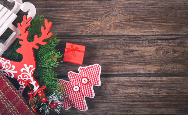 istock Christmas decoration on wooden rustic plank. 869915056