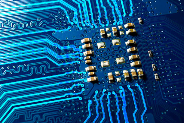 istock blue circuit board and glowing line macro photo 869918950
