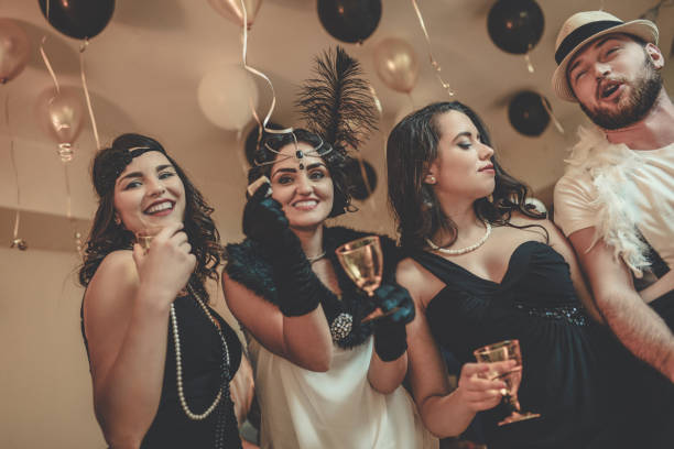istock Group of Smiling Friends Having Great Party at Night 869918992