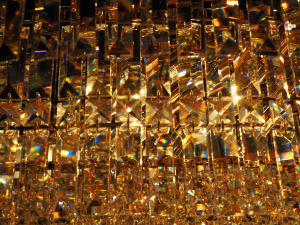 istock Close up small crystal square pattern chandelier, warm yellow light 869925482