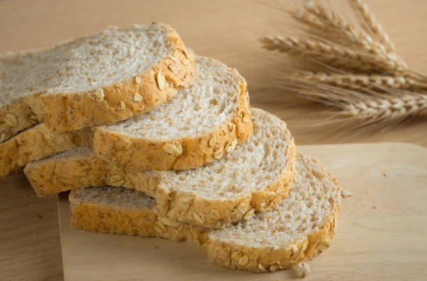 istock Whole wheat breads on cutting board,still life. 869926324