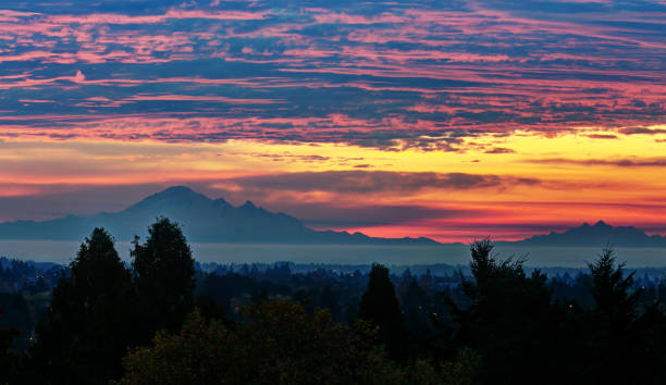 istock Sunrise glow over Mt. Baker, view from Vancouver, BC, Canada 869929580