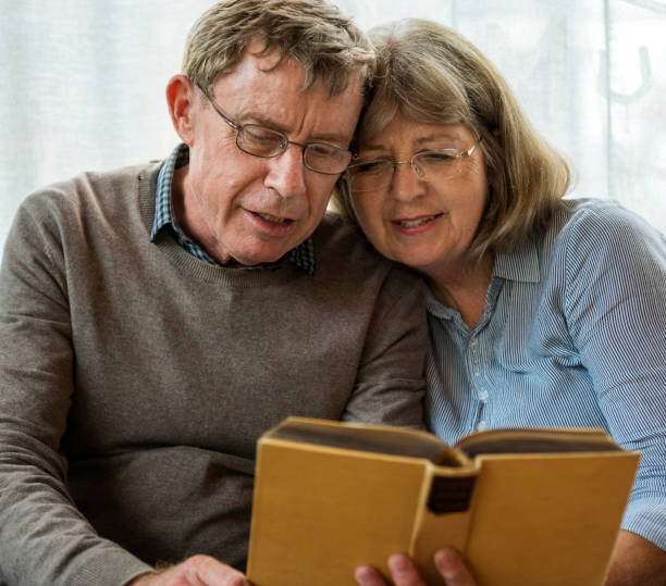 istock Mature Couple Reading Books Together 869935774