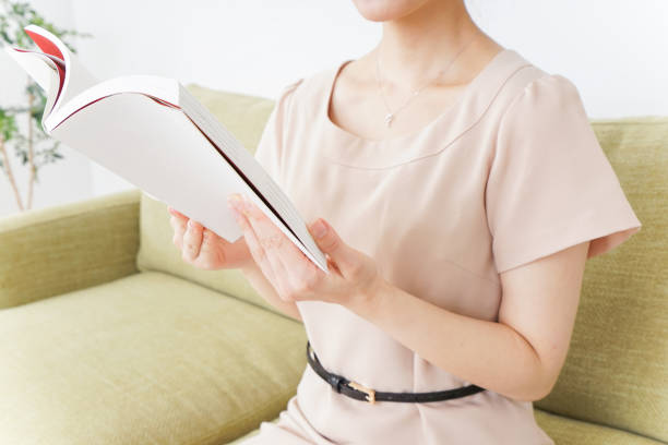 istock woman reading books in room 869939830