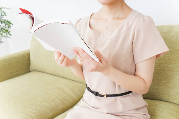 istock woman reading books in room 869939844