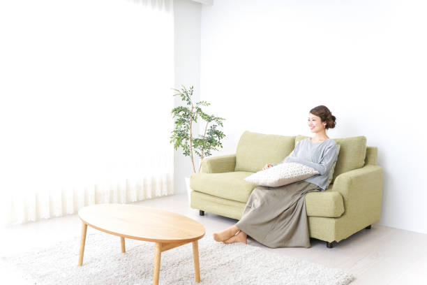 istock woman watching TV at home 869940484