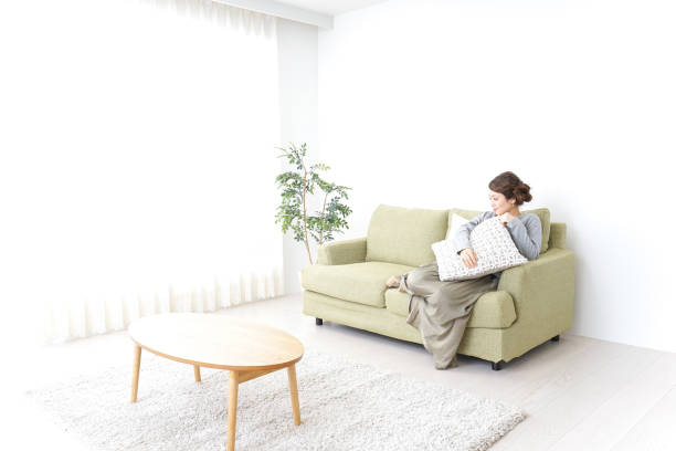 istock single woman being relaxed at home 869943150