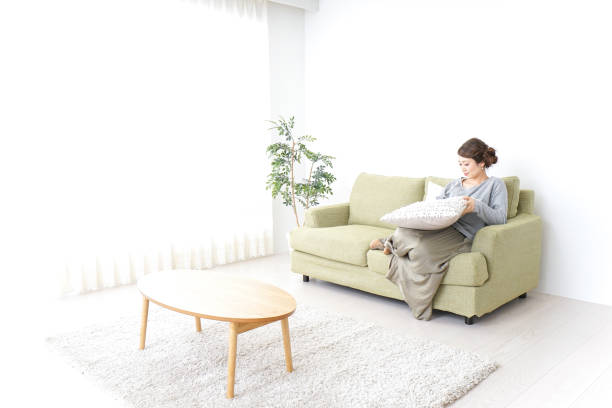 istock single woman being relaxed at home 869943156