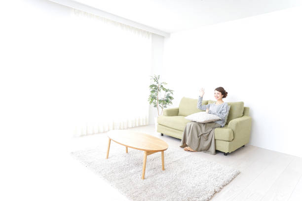 istock single woman being relaxed at home 869943166