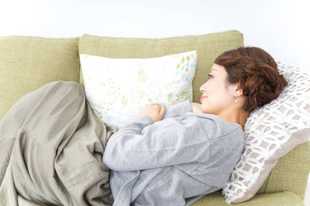 istock sleeping woman at home 869943672