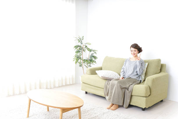istock Woman pointing to something at home 869943958