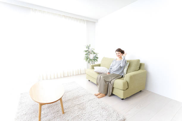 istock Woman pointing to something at home 869943978