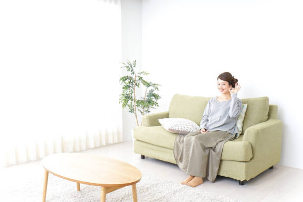 istock Woman pointing to something at home 869943998